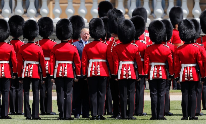 President Donald Trump reviews an honor guard during a ceremonial welcome in the garden of Buckingham Palace in London, Monday, June 3, 2019 on the opening day of a three day state visit to Britain. (AP Photo/Frank Augstein)