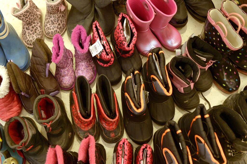 (Leah Hogsten  |  The Salt Lake Tribune) Volunteers pack boots, blankets, winter clothing and other donations at Saint Ambrose Catholic Church in 2016.