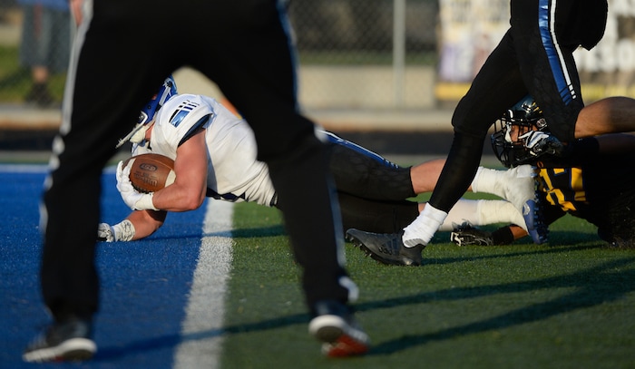 (Francisco Kjolseth  |  The Salt Lake Tribune)  Bingham's Braedon Wissler slips into the end zone for a touchdown in the first half of their game against Orem, Thursday, Aug. 16, 2018 in Orem.