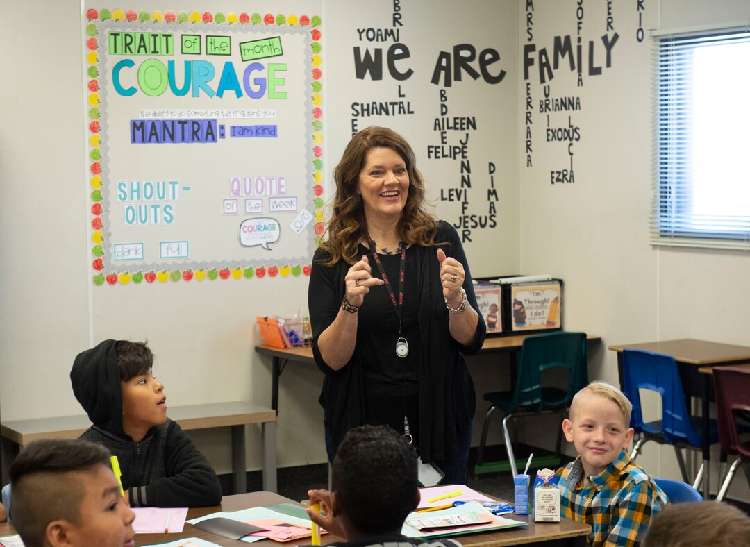 (Rick Egan  |  The Salt Lake Tribune)         Jeri Rigby, the new principal of Copperview Elementary School, sings along with students, on the first day of school, Monday, Aug. 19, 2019.