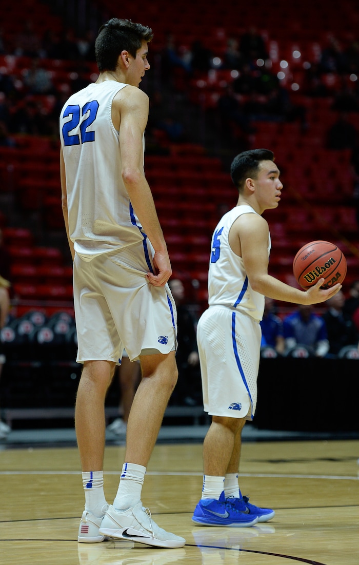 (Francisco Kjolseth  |  The Salt Lake Tribune)  Weber vs Pleasant Grove, 6A State high school basketball tournament at the Huntsman Center in Salt Lake City, Thursday March 1, 2018. Teammates Matthew Van Komen, (22) and Kainoa Maldonado (15). 