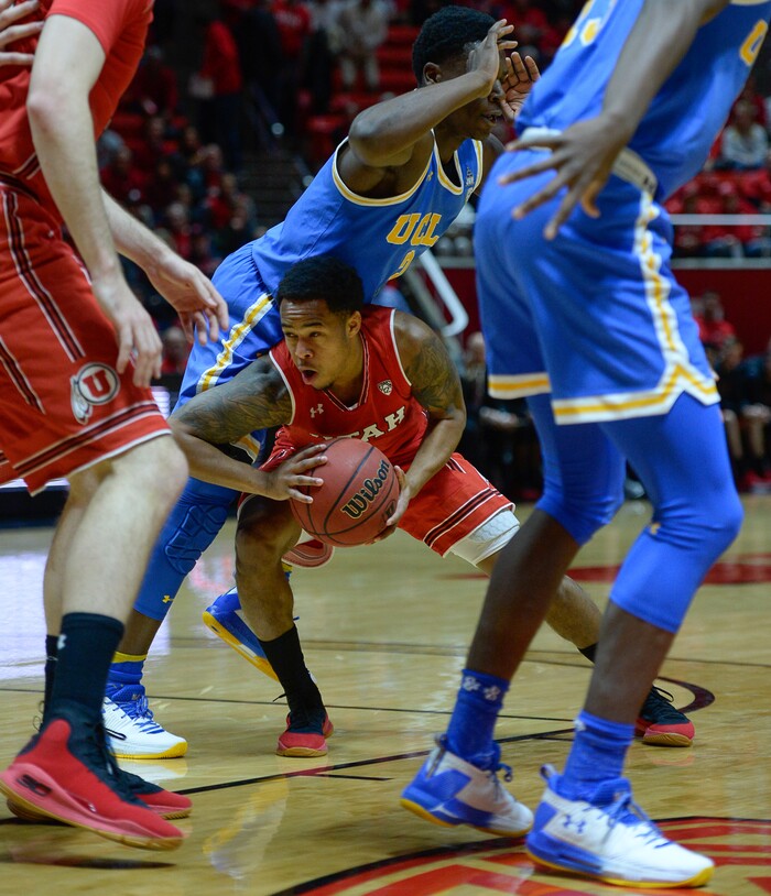 (Francisco Kjolseth  |  The Salt Lake Tribune)  Utah Utes guard Justin Bibbins (1) gets buried by UCLA as the University of Utah hosts UCLA in NCAA basketball at the Huntsman Center in Salt Lake City, Thursday, Feb. 22, 2018.
