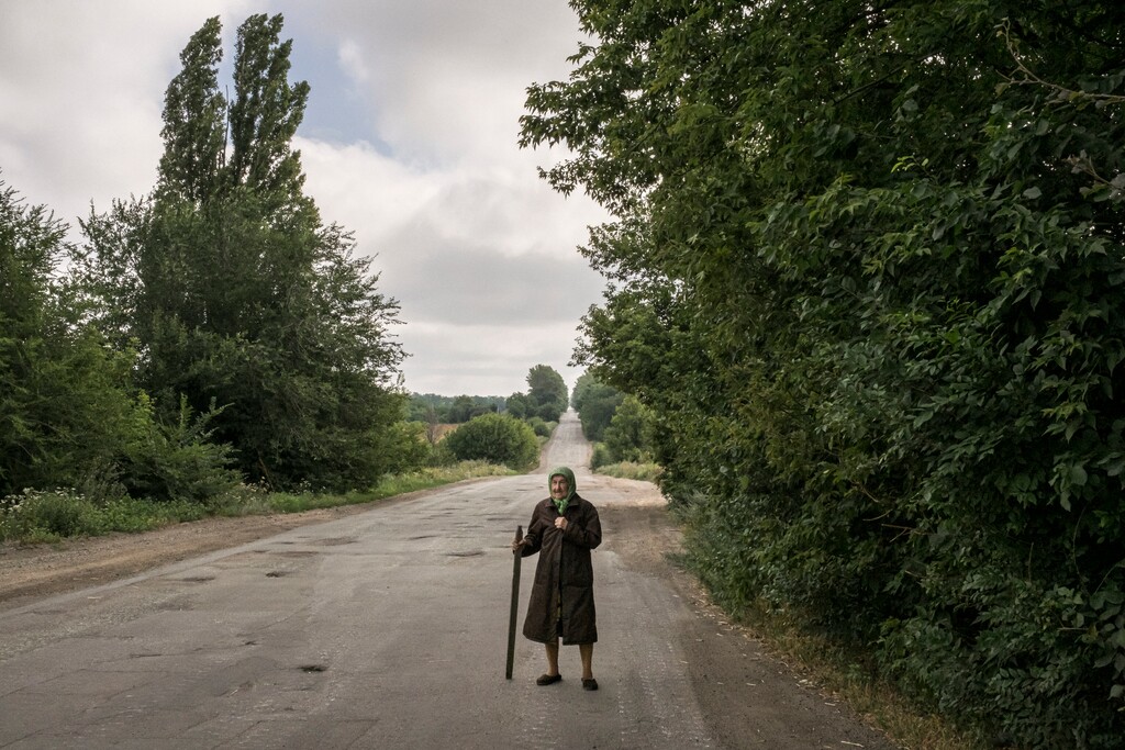 (Mauricio Lima | The New York Times)

An elderly Ukrainian villager walks along a road on the outskirts of Dibrova on July 23, 2022.