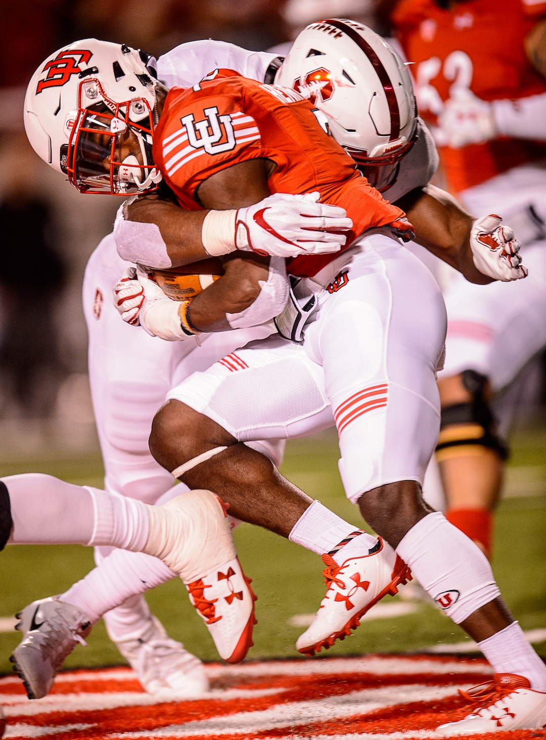 (Trent Nelson | The Salt Lake Tribune)  Utah Utes running back Zack Moss (2) is hit by a Stanford Cardinal linebacker Peter Kalambayi (34) as the University of Utah hosts Stanford, NCAA football at Rice-Eccles Stadium in Salt Lake City Saturday October 7, 2017.