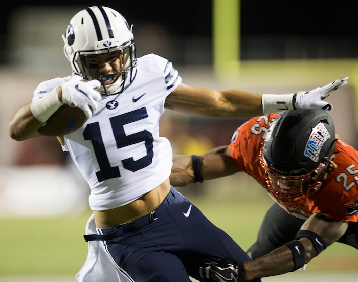 BYU wide receiver Aleva Hifo (15) runs the ball against UNLV linebacker Gabe McCoy (25) during an NCAA college football game Friday, Nov. 10, 2017, in Las Vegas. (Erik Verduzco/Las Vegas Review-Journal via AP)
