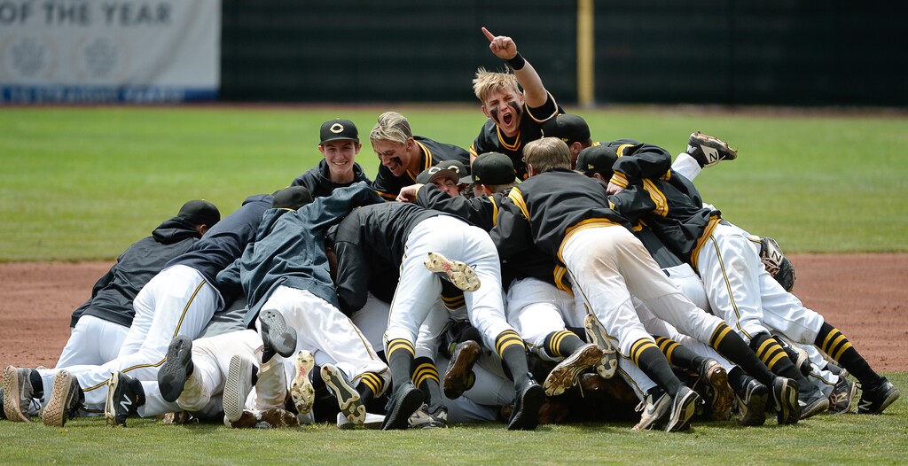(Francisco Kjolseth  |  The Salt Lake Tribune)  Cottonwood High School players celebrate their victory over Timpanogos for last season's Utah 5A state baseball title. Utah's spring sports have been canceled this year due to the coronavirus crisis.

 pitcher Carson Angeroth is mobbed by his teammates after striking out Timpanogos in a 6-5 win during the 5A baseball championship game at UCCU Stadium on the UVU campus in Orem, Friday, May 24, 2019.