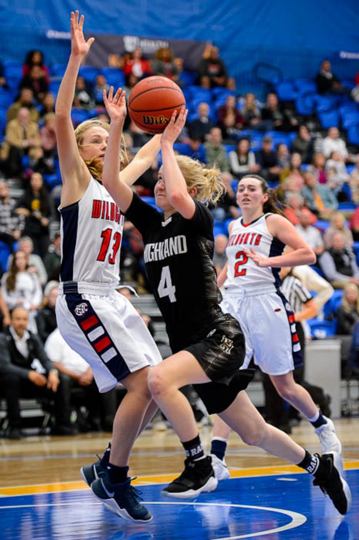 (Trent Nelson | The Salt Lake Tribune)  Highland's Olivia Beckstead (4) drives on Woods Cross's Sara Noel (13) as Woods Cross faces Highland in the 5A High School Girls' Basketball Tournament at SLCC in Taylorsville, Wednesday Feb. 21, 2018.