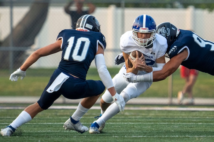 (Rick Egan | The Salt Lake Tribune) Dallen Martinez (12) runs for the Chargers as  Jackson Buehler defends for the Chargers, in defends for Bingham  prep football action between the Corner Canyon Chargers and the Bingham Miners, on Friday, Aug. 27, 2021.
