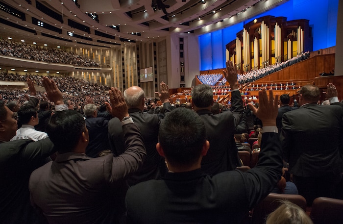 (Rick Egan  |  The Salt Lake Tribune)         Melchizedek priesthood raise their right hands as they sustain President Russell M. Nelson and the first presidency of the church, during a  Solemn Assembly in the Saturday morning session of the 188th Annual General Conference in Salt Lake City,  Saturday, March 31, 2018.