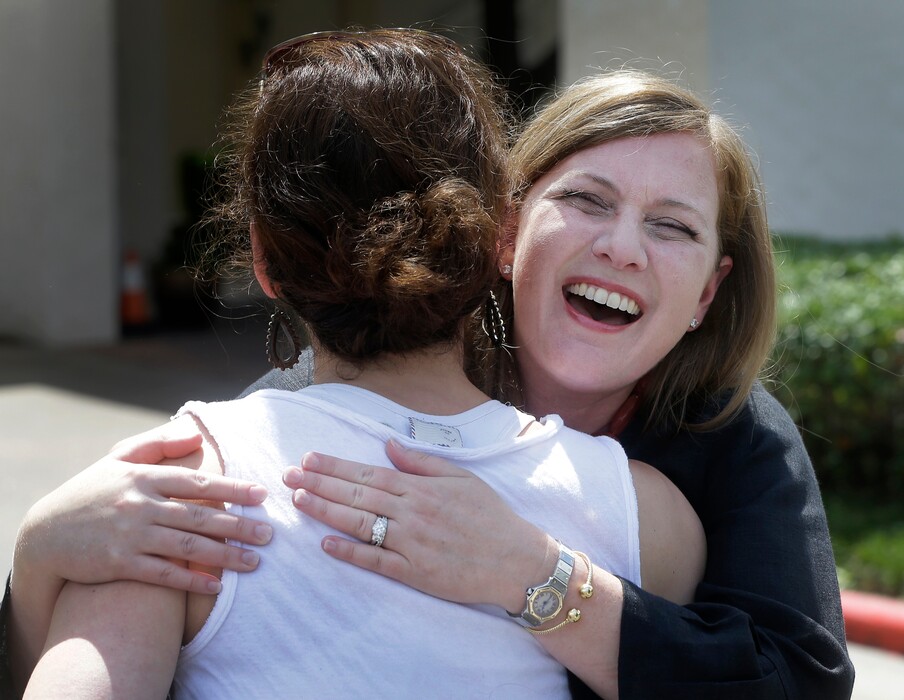 Lizzie Pannill Fletcher, a Democrat candidate for the 7th Congressional District, hugs supporter Annie Arnoult as she arrives to vote in the primary runoff at St. Anneís Church, Tuesday, May 22, 2018 in Houston. (Melissa Phillip/Houston Chronicle via AP)