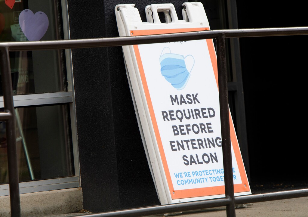 (Rick Egan  |  Tribune file photo)  A sign requiring masks at the Great Clips on 400 South in Salt Lake City, Wednesday, May 20, 2020.