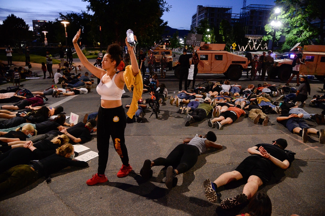 (Francisco Kjolseth  |  The Salt Lake Tribune)  Demonstrators protesting against police brutality lay down in silence in honor of George Floyd on on the street outside the Salt Lake City Public Safety Building on Wednesday, June 3, 2020.