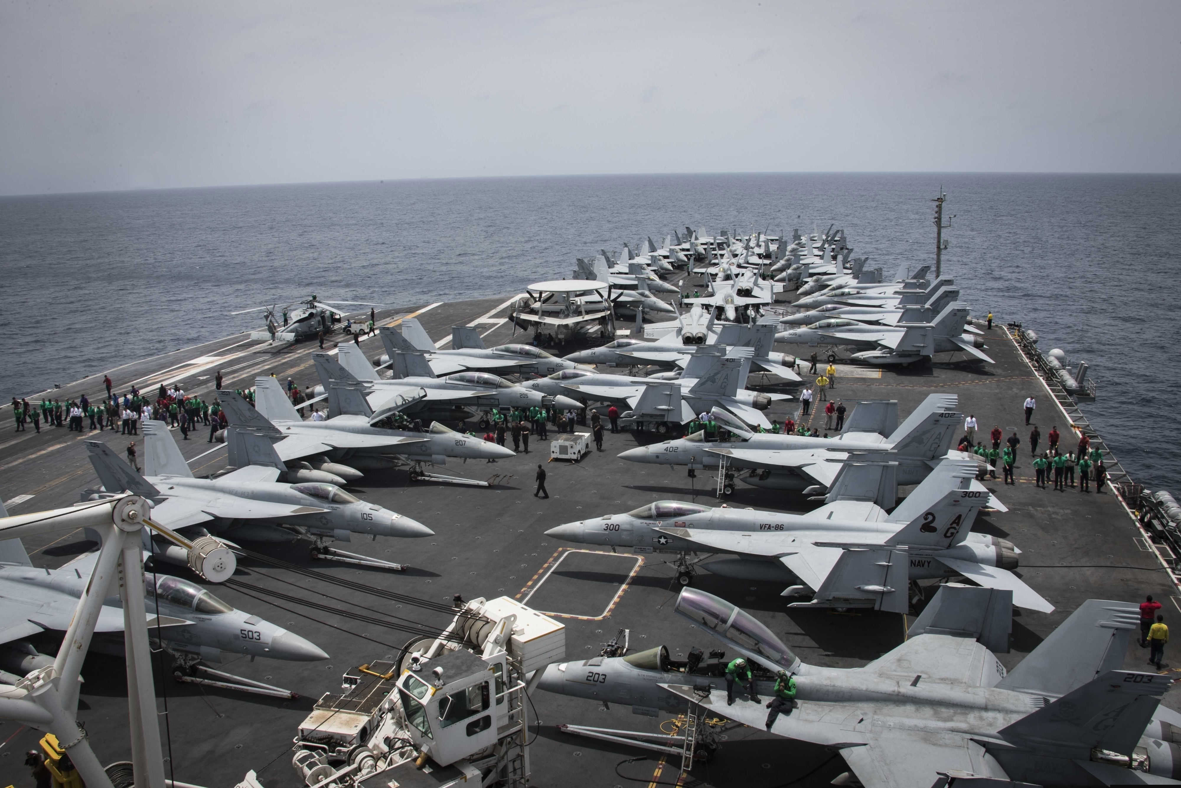 (Mass Communication Specialist 3rd Class Garrett LaBarge | U.S. Navy | AP) In this Sunday, May 19, 2019, photo released by the U.S. Navy, sailors partake in a foreign object and debris walk-down on the flight deck of the Nimitz-class aircraft carrier USS Abraham Lincoln in the Arabian Sea.