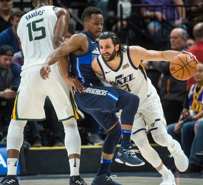 (Rick Egan  |  The Salt Lake Tribune)    Utah Jazz forward Derrick Favors (15) sets a sets a screen, as Dallas Mavericks guard Dennis Smith Jr. (1) tries to keep up with Utah Jazz guard Ricky Rubio (3), in NBA action between Utah Jazz and Dallas Mavericks in Salt Lake City, Saturday, Feb. 24, 2018.