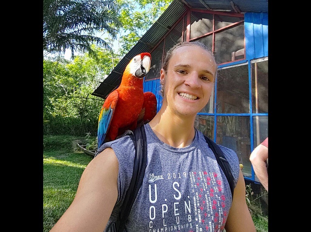 (Photo courtesy of Jonny Vizmeg) Jonny Vizmeg is currently in Colombia and doesn't know when he'll return home to Salt Lake City due to COVID-19 travel restrictions. Vizmeg is pictured with a macaw on his shoulder during one his first tours as a translator in Puerto Nariño.