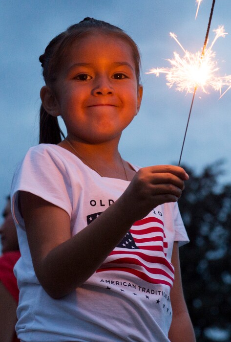 Rick Egan  |  The Salt Lake TribuneKacie Kiker, 11, Layton, plays with a sparkler before the Sugarhouse fireworks, Saturday, July 4, 2015.s