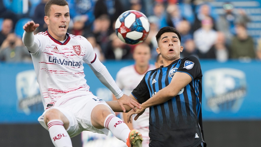 Montreal Impact's Mathieu Choiniere, right, challenges Real Salt Lake's Brooks Lennon during the first half of an MLS soccer match Wednesday, May 29, 2019, in Montreal. (Graham Hughes/The Canadian Press via AP)