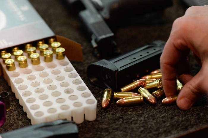 (Francisco Kjolseth  |  The Salt Lake Tribune)  A members of The Well-Armed Woman group reloads during one of their monthly training sessions at The Gun Vault in South Jordan recently.