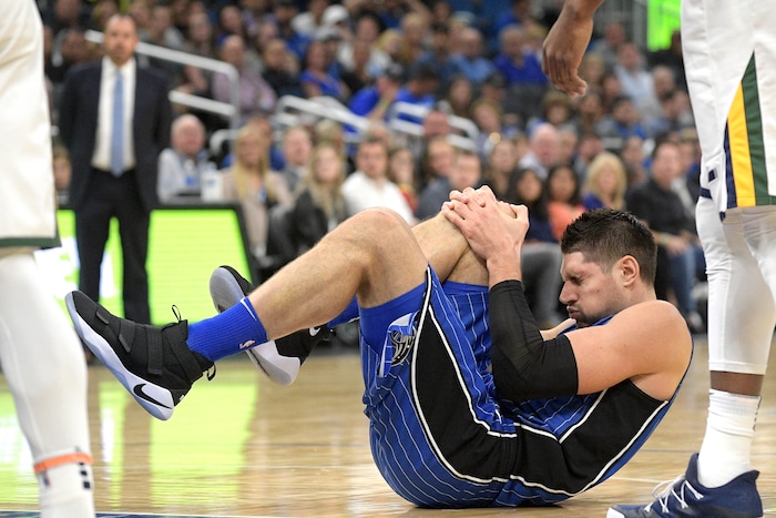 Orlando Magic center Nikola Vucevic grimaces after being fouled by Utah Jazz guard Ricky Rubio during the first half of an NBA basketball game Saturday, Nov. 18, 2017, in Orlando, Fla. (AP Photo/Phelan M. Ebenhack)