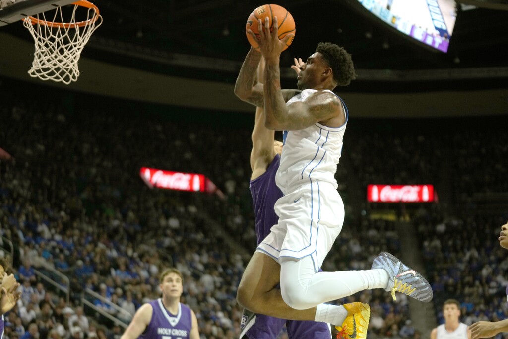 (Rick Egan | The Salt Lake Tribune) Kennard Davis Jr goes to the hoop at the Marriott Center earlier this season.

