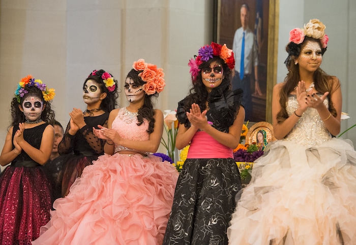 (Leah Hogsten | The Salt Lake Tribune) Costume contestants walk in the hall of governors at the Day of the Dead festival Saturday, October 21, 2017 at the Capitol.