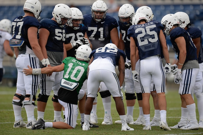 (Francisco Kjolseth  |  The Salt Lake Tribune)  Quarterback Koy Detmer Jr., gathers the team for a play as BYU holds a scrimmage at LaVell Edwards Stadium in Provo on Thursday, Aug. 10, 2017.
