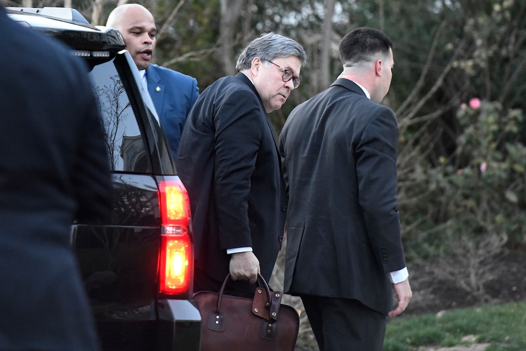 (AP Photo/Sait Serkan Gurbuz) Attorney General William Barr carries his briefcase as he arrives at home in McLean, Va., on Friday evening, March 22, 2019. Special counsel Robert Mueller has concluded his investigation into Russian election interference and possible coordination with associates of President Donald Trump. The Justice Department says Mueller delivered his final report to Barr.