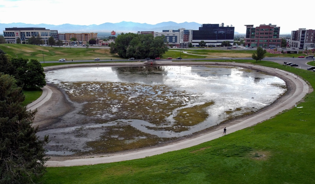 (Francisco Kjolseth | The Salt Lake Tribune) Salt Lake County begins draining Sugar House Park pond early due to dry conditions and to prevent wild birds from getting sick as seen on Monday, July 19, 2021.