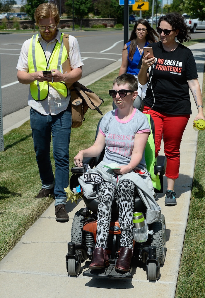 (Francisco Kjolseth  |  The Salt Lake Tribune)  Activists Psarah Johnson talks about locking herself alongside other activists in the lobby of a private prison company with contracts to hold undocumented immigrants on Thursday, July 12, 2018, at the headquarters of Management and Training Corporation in Centerville. Johnson was released after being charged with disorderly conduct, trespassing and resisting arrest and believes she was let go while others were arrested because "the police is not ADA compliant." 
