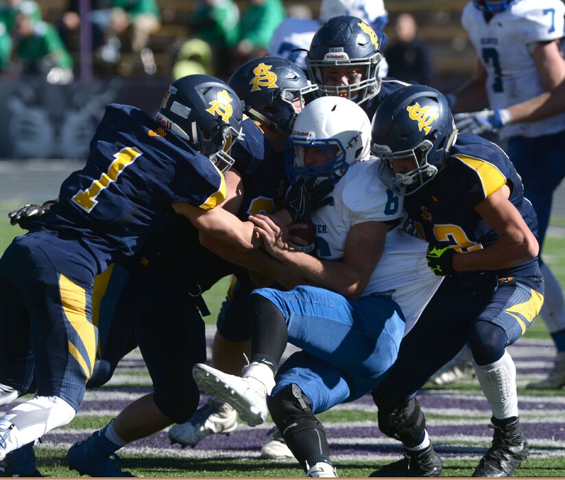 Steve Griffin | The Salt Lake Tribune
Summit Academy defense wraps up Beaver quarterback Jordan Hardy during their state playoff game last season.