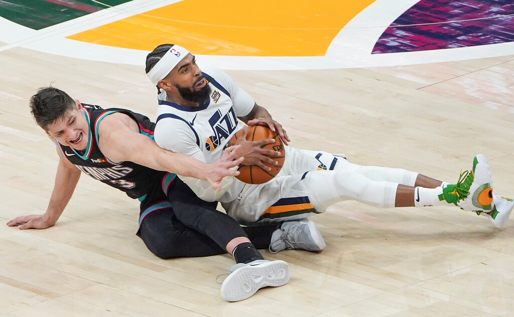 (Leah Hogsten | The Salt Lake Tribune) Utah Jazz guard Mike Conley (10) and Memphis Grizzlies guard Grayson Allen (3) hits the deck as Conley tries to keep the ball as the Utah Jazz host the Memphis Grizzlies, Mar. 26, 2021 at Vivint Arena. 