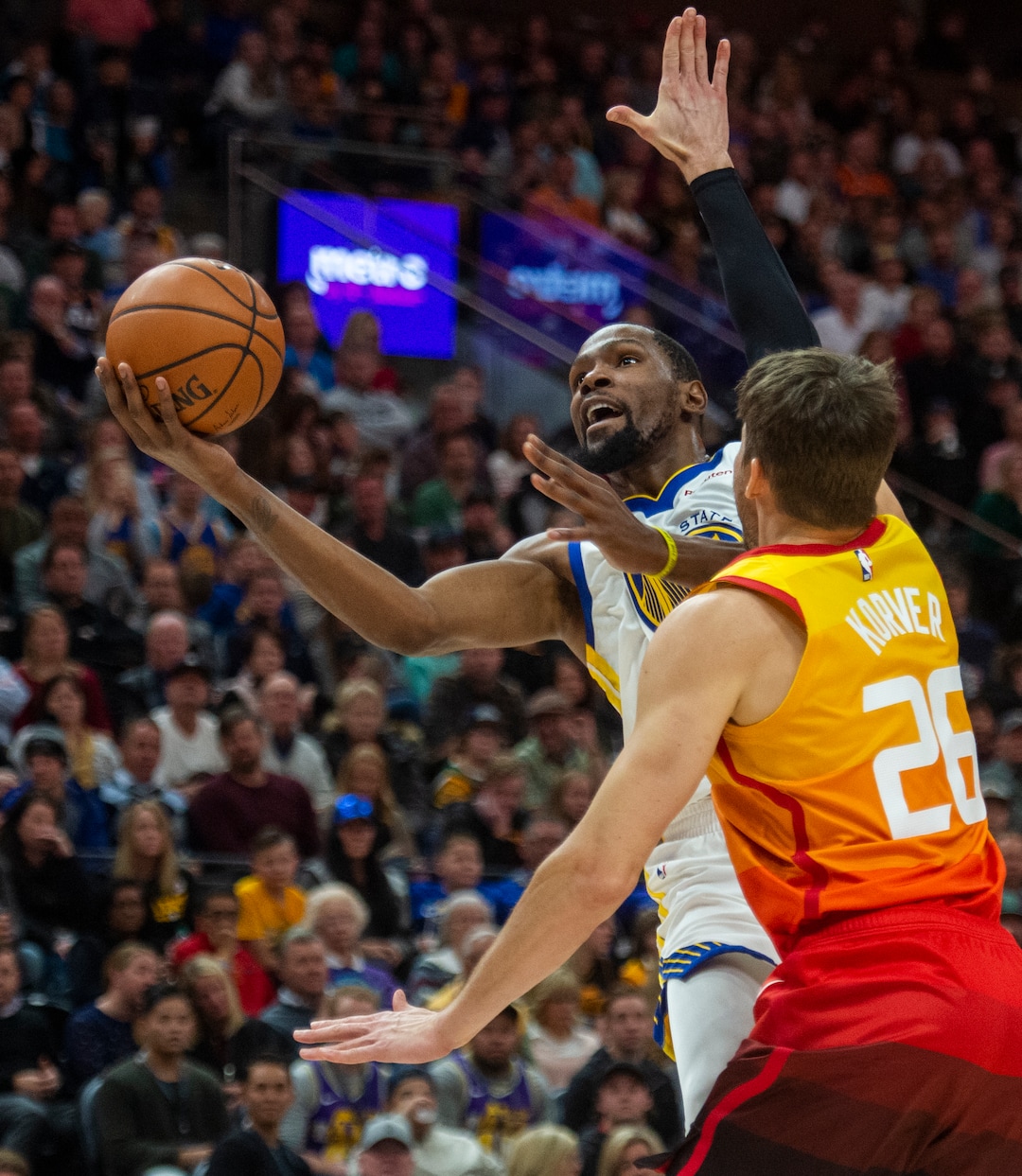 (Rick Egan  |  The Salt Lake Tribune)    Golden State Warriors forward Kevin Durant (35) goes in for a shot as Utah Jazz guard Kyle Korver (26) defends, in NBA action between Utah Jazz and Golden State Warriors, in Salt Lake City, Wednesday, Dec. 19, 2018.