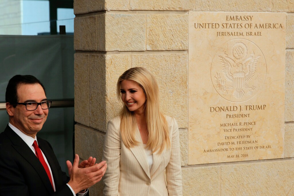 U.S. President Donald Trump's daughter Ivanka Trump, right, and U.S. Treasury Secretary Steve Mnuchin attend the opening ceremony of the new U.S. embassy in Jerusalem, Monday, May 14, 2018. Amid deadly clashes along the Israeli-Palestinian border, President Donald Trump's top aides and supporters on Monday celebrated the opening of the new U.S. Embassy in Jerusalem as a campaign promised fulfilled. (AP Photo/Sebastian Scheiner)