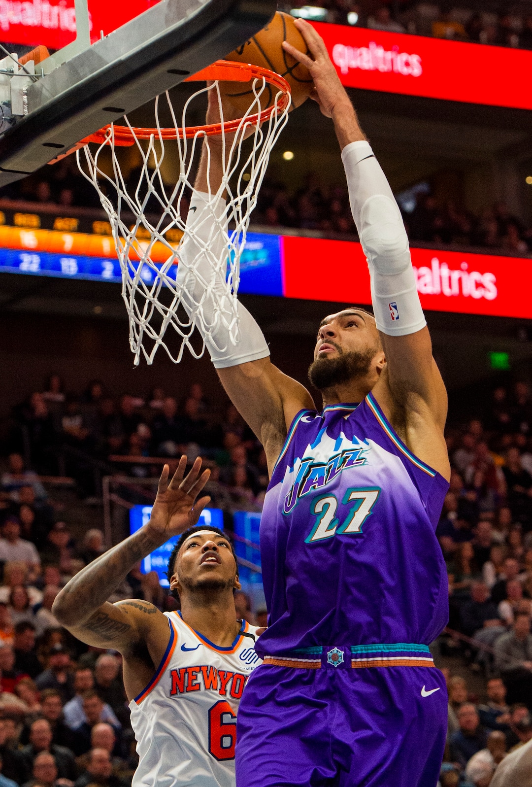 (Rick Egan  |  The Salt Lake Tribune)  Utah Jazz center Rudy Gobert (27) goes in for a slam dunk as New York Knicks guard Elfrid Payton (6) looks on, in NBA action between the Utah Jazz and the New York Knicks, in Salt Lake City, Wednesday, Jan. 8, 2020.