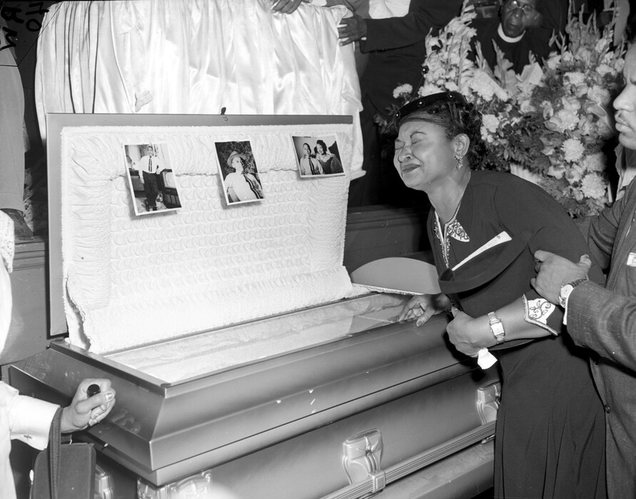 Mamie Till Mobley weeps at her son's funeral on Sept. 6, 1955, in Chicago.  Till, mother of Emmett Till, insisted that her son's body be displayed in an open casket forcing the nation to see the brutality directed at blacks in the South at the time.   The FBI announced Wednesday, May 4, 2005, that Till's body will be exhumed to conduct an autopsy, which was never performed, and determine the cause of death. (AP Photo/Chicago Sun-Times)