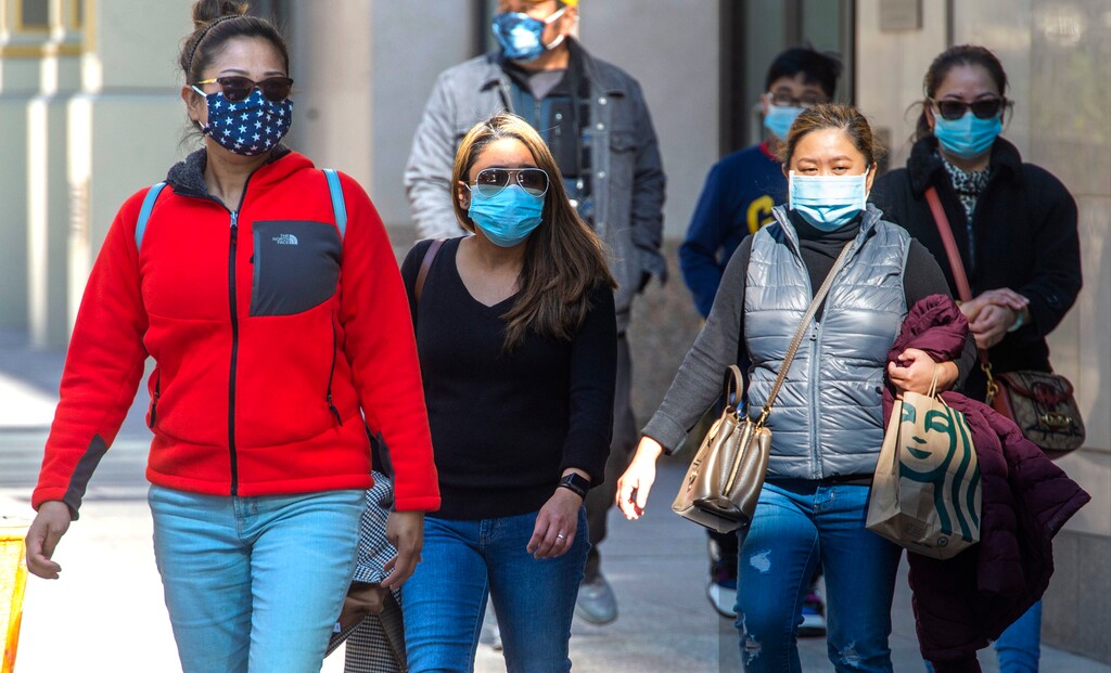 (Rick Egan | The Salt Lake Tribune)  Pedestrians wear masks in downtown Salt Lake City, Friday, Oct. 30, 2020.