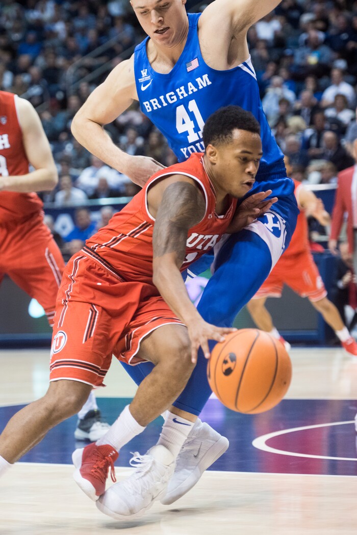 (Rick Egan  |  The Salt Lake Tribune)   Utah Utes guard Kolbe Caldwell (2) tries to get past Brigham Young Cougars forward Luke Worthington (41), in basketball action Utah Utes vs. Brigham Young Cougars at the Marriott Center in Provo, Saturday, December 15, 2017.


