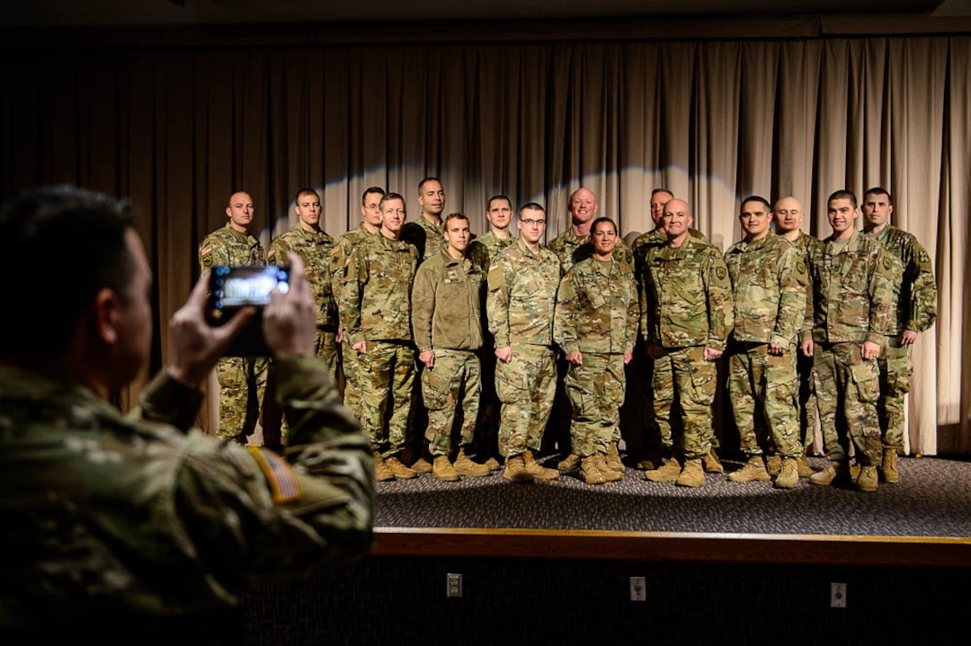 (Trent Nelson | The Salt Lake Tribune)  Eighteen Utah National Guard soldiers deploying to Fort Meade, Maryland, for 400 days to conduct cyber protection operations pose for a photograph at their departure ceremony in Draper on Wednesday Jan. 2, 2019.