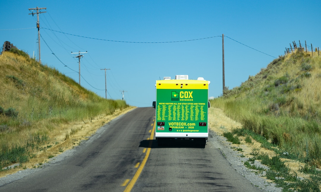 (Francisco Kjolseth  |  The Salt Lake Tribune)  Lt. Gov. Spencer Cox hits the road in his dad's RV, fresh with a campaign wrap in John Deere colors and all 248 cities and towns printed on the back as he attempts to visit each one during his gubernatorial campaign tour on Tuesday, July 30, 2019.