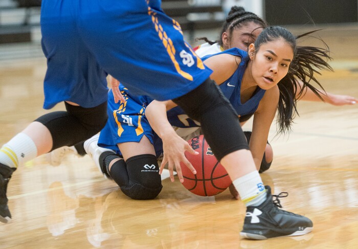 (Rick Egan  |  The Salt Lake Tribune)   Tasiah Little (21) San Juan, goes for a loose ball, along with Victoria Garcia (40) Judge Memorial, in 3A Women's basketball State playoff action Judge Memorial vs. San Juan, in Heber City, Friday, Feb. 16, 2018.
