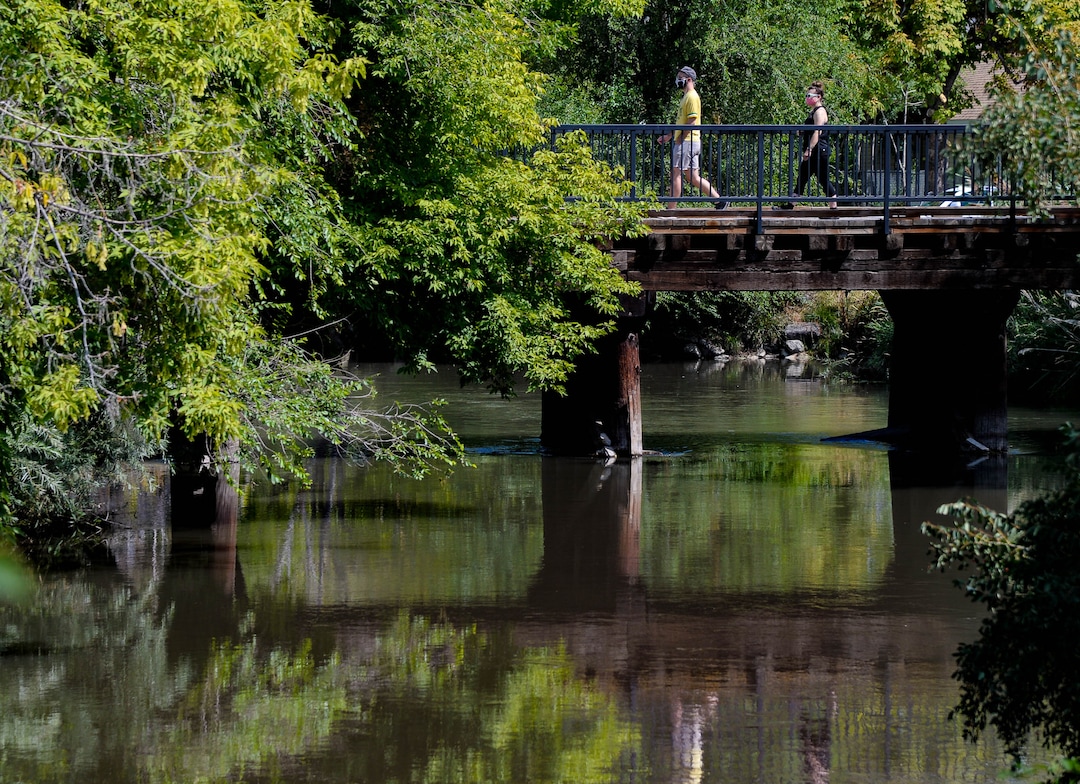 (Francisco Kjolseth  |  The Salt Lake Tribune) People recreate near the International Peace Gardens along the Jordan River Parkway on Wednesday, August 5, 2020, as new grant money becomes available to refresh the comprehensive master plan for the 51-mile parkway stretching from Utah Lake in Utah County to the wetlands of the Great Salt Lake.