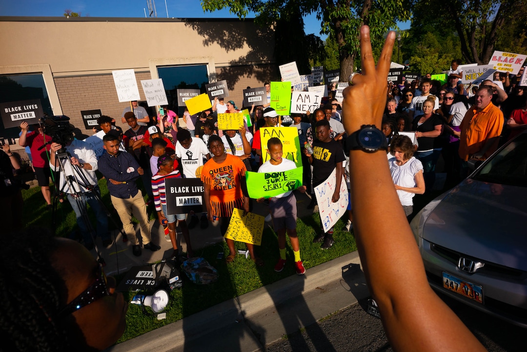 (Trent Nelson  |  The Salt Lake Tribune)A protest organized by Black Lives Matter and other groups at the Woods Cross Police Department on Friday June 14, 2019. The rally was to show support for DJ Hrubes, a 10-year-old black child who was held at gunpoint by a police officer last week while playing in his grandmother's front yard.