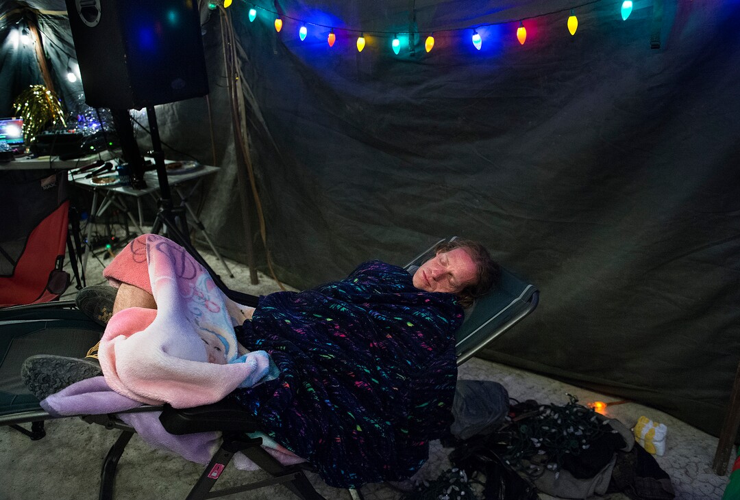 (Scott Sommerdorf | The Salt Lake Tribune)Matt Van Horn, the winner of the Salt Flats 100 Endurance Run sleeps at 6 a.m. in Aid Station 14, Saturday, May 5, 2018. Van Horn finished the race at around 1 a.m., and was so full of energy, he immediately sang a round of karaoke with volunteers at the checkpoint.