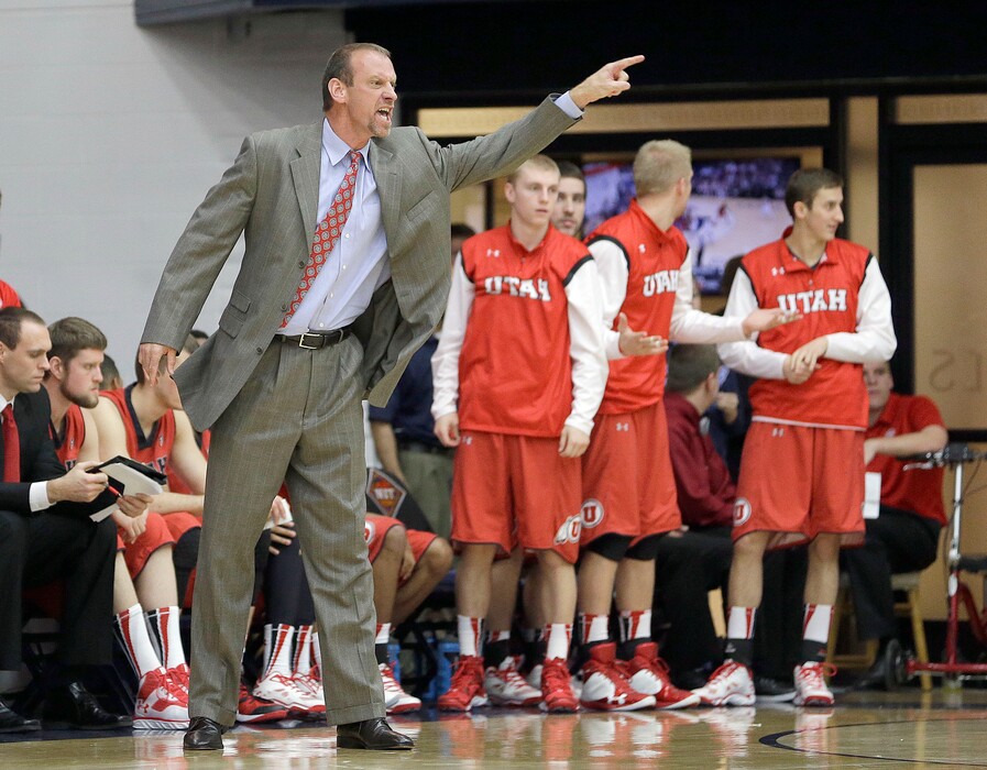 Utah coach Larry Krystkowiak argues a call with the referee during the second half against St. Mary's of an NCAA college basketball game in the first round of the National Invitational Tournament in Moraga, Calif., Tuesday, March 18, 2014. St Mary's won 70-58. (AP Photo/Tony Avelar)
