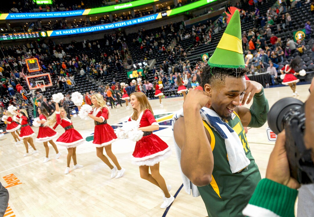 Leah Hogsten  |  The Salt Lake Tribune  Utah Jazz guard Donovan Mitchell (45) wears an elf hat placed on his head by teammate Rudy Gobert after the win. The Utah Jazz defeated the Portland Trail Blazers, 117-96, Christmas night at Vivint Smart Home Arena.
