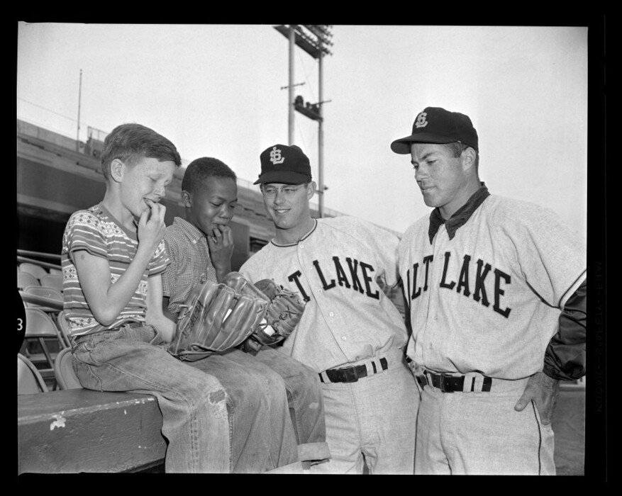 (Salt Lake Tribune) Ahead of the Salt Lake Bees' season opener in April 1959, Terry Mascher, left, and Paul Williams offer tips to Bees pitchers Don Row and Hugh Pepper, right. Pro baseball in Salt Lake has been played at 1300 South and West Temple for nearly a century.