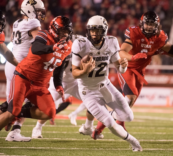 Utah Utes defensive tackle Filipo Mokofisi (45) chases down Colorado Buffaloes quarterback Steven Montez (12), in PAC-12 football action Utah Utes vs. Colorado Buffaloes at Rice-Eccles stadium, Saturday, November 25, 2017.