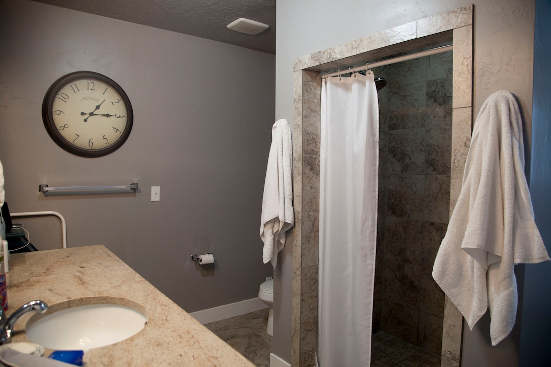 (Stella Yu |  The Salt Lake Tribune) The 2,713-square-foot rambler home in South Jordan includes five bedrooms, three and a half baths, two family rooms, a fireplace, a kitchen, a bar and a semi-formal dining room. A two-car garage is attached to the house with outdoor RV parking space.
