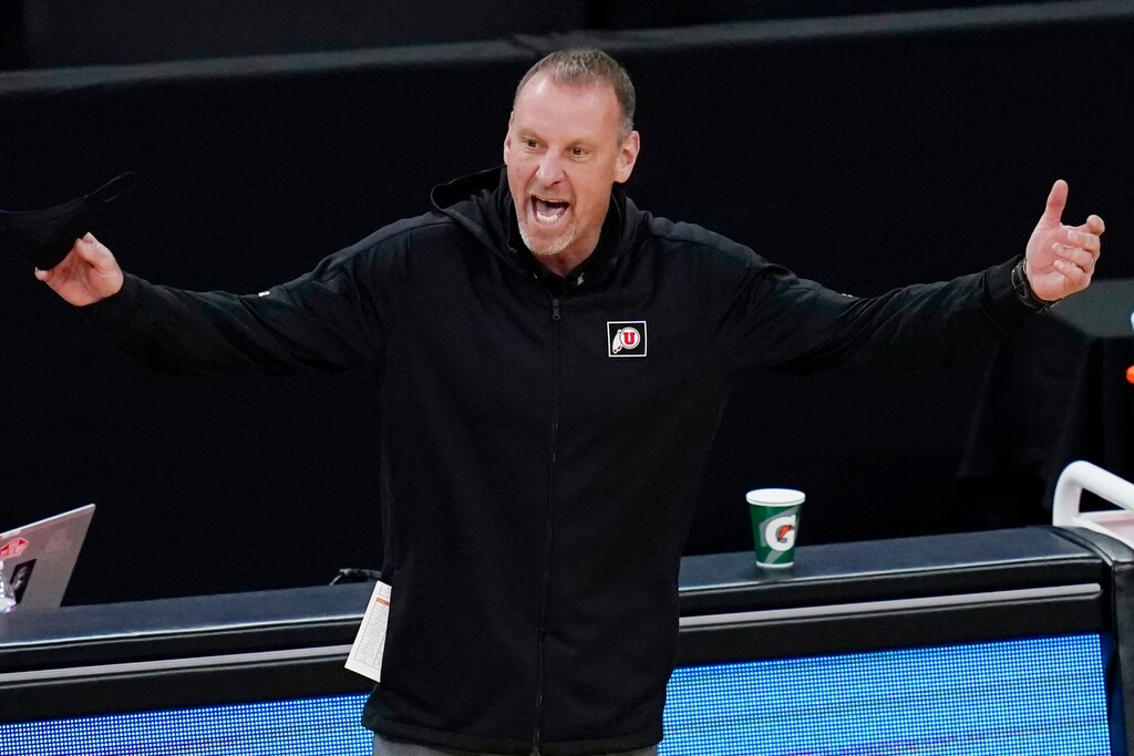 (AP Photo/John Locher) | Utah head coach Larry Krystkowiak reacts during the first half of an NCAA college basketball game against Southern California in the quarterfinal round of the Pac-12 men's tournament Thursday, March 11, 2021, in Las Vegas. It turned out to be his final game as the Utes' coach.