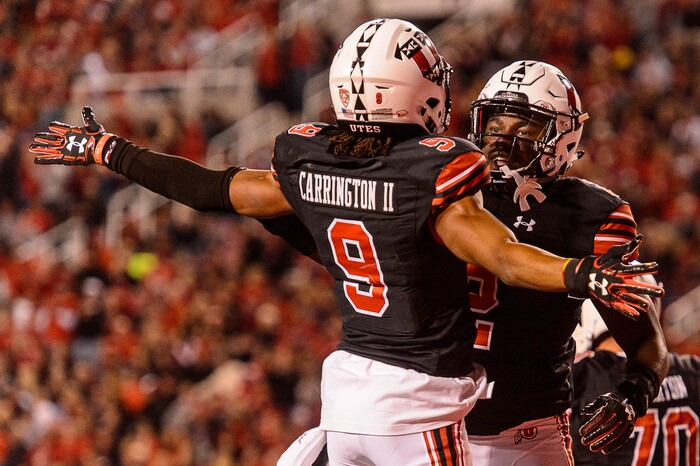 (Trent Nelson | The Salt Lake Tribune) Utah Utes running back Zack Moss (2) celebrates a touchdown with teammate Utah Utes wide receiver Darren Carrington II (9) as the Utah Utes host the San Jose State Spartans, NCAA football at Rice-Eccles Stadium in Salt Lake City, Saturday September 16, 2017.